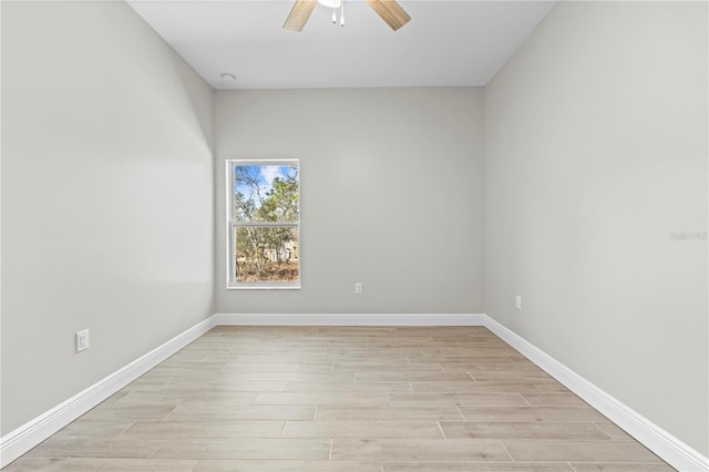 11345 Thrasher Ave, Weeki Wachee, FL 34614 - unfurnished room with a ceiling fan, light wood-style floors, and baseboards