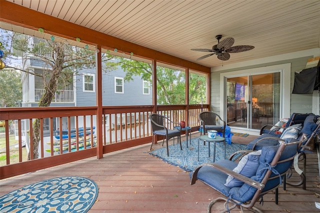 sunroom with ceiling fan