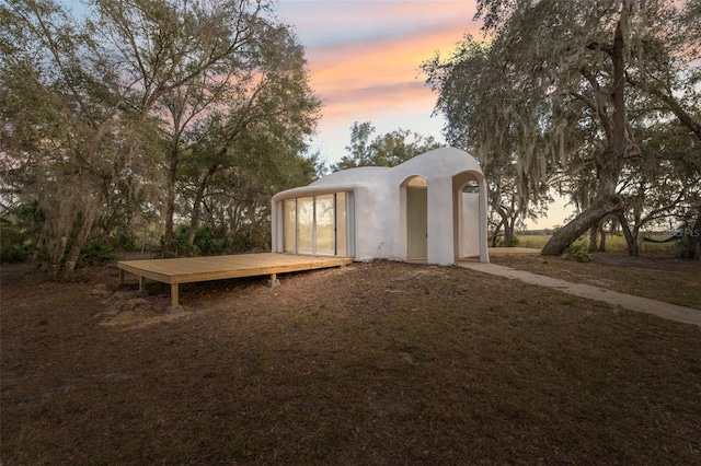 view of outdoor structure at dusk