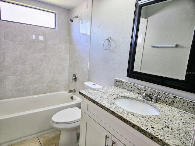 bathroom featuring washtub / shower combination, vanity, toilet, and tile patterned floors