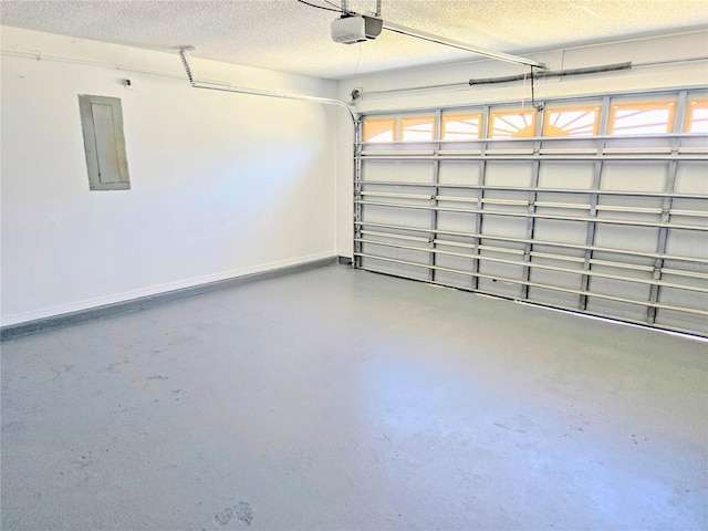 garage featuring electric panel, baseboards, and a garage door opener