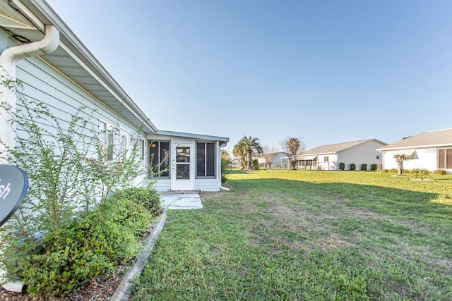 view of yard with a sunroom