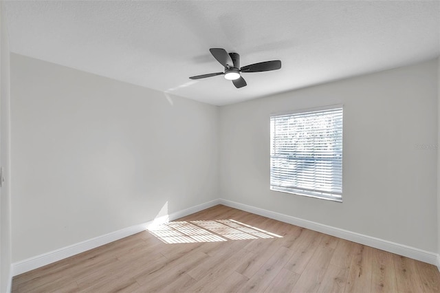 unfurnished room with light wood-type flooring, a textured ceiling, and ceiling fan