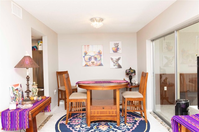 dining area featuring light tile patterned floors