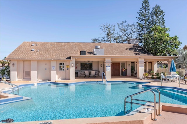 view of pool with ceiling fan and a patio area