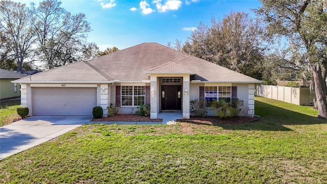 single story home featuring a garage and a front lawn