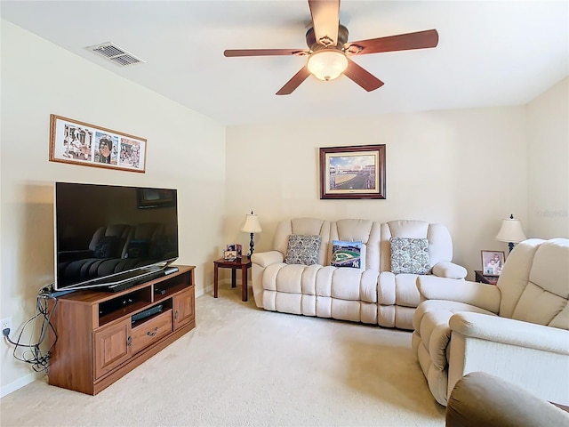 living room featuring light colored carpet and ceiling fan