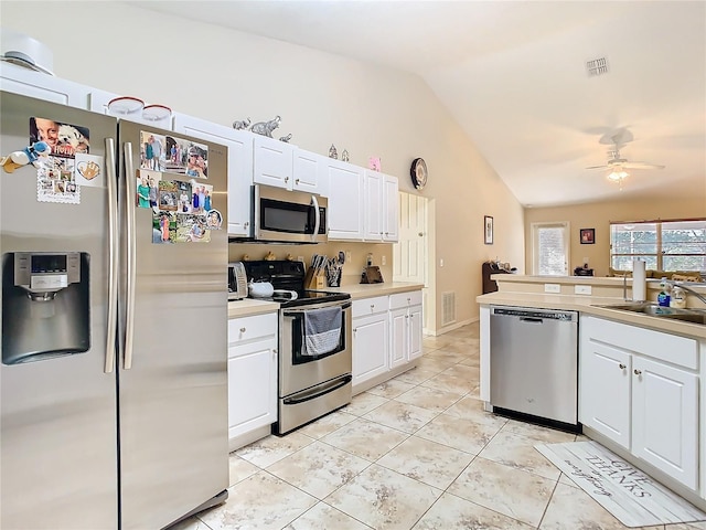 kitchen featuring white cabinetry, appliances with stainless steel finishes, and sink