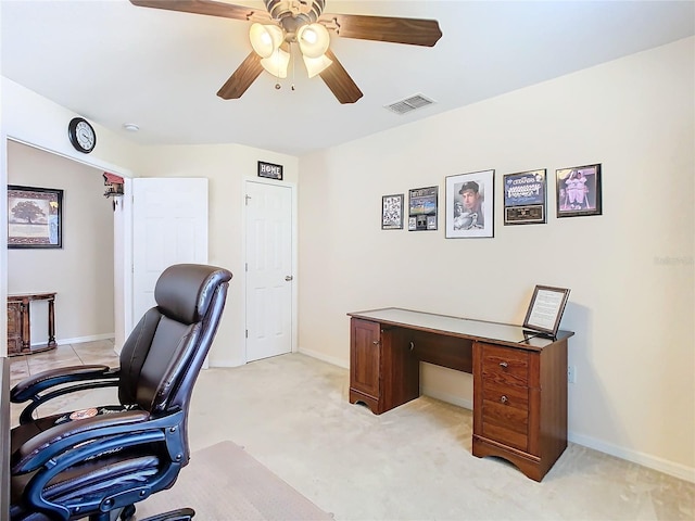 carpeted home office with ceiling fan