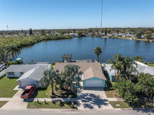 drone / aerial view featuring a residential view and a water view