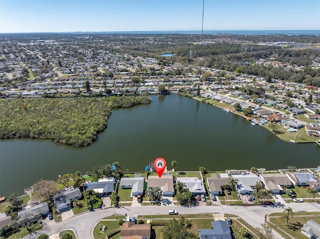 drone / aerial view with a residential view and a water view