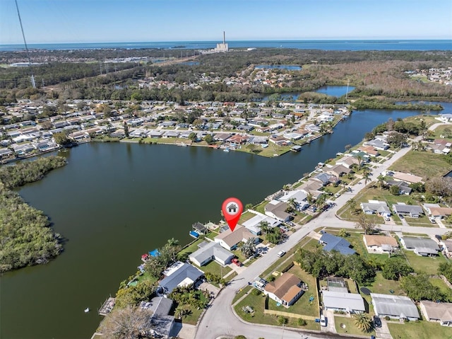 birds eye view of property with a water view and a residential view