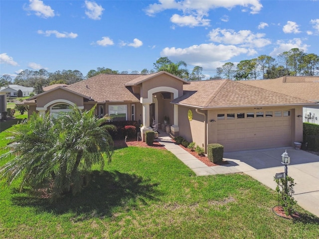 view of front of home with a garage and a front lawn