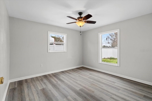 unfurnished room with ceiling fan and light hardwood / wood-style flooring