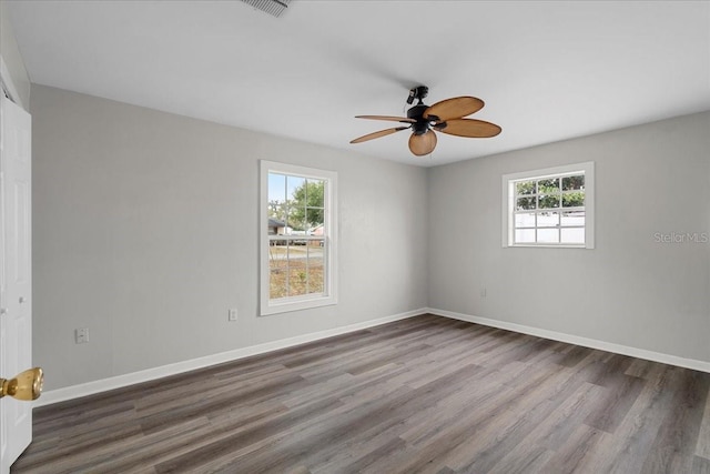 unfurnished room featuring ceiling fan and hardwood / wood-style floors