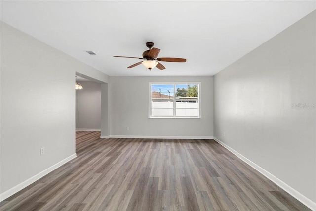 spare room with ceiling fan and light hardwood / wood-style flooring