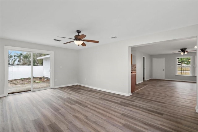 spare room featuring dark hardwood / wood-style floors and ceiling fan