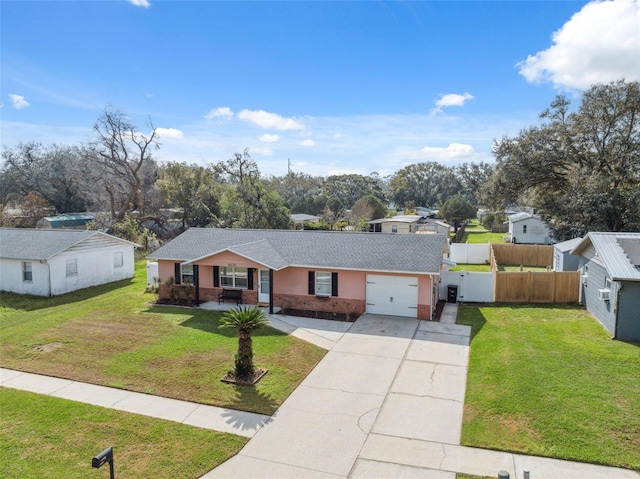 single story home featuring covered porch, a front yard, and a garage