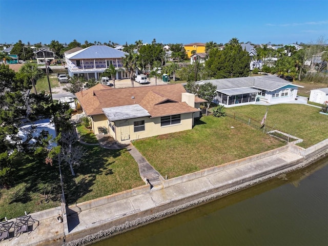 drone / aerial view with a water view