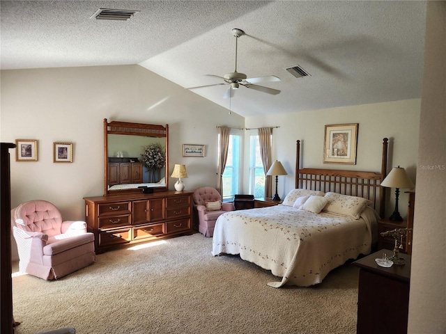 bedroom with lofted ceiling, carpet floors, ceiling fan, and visible vents