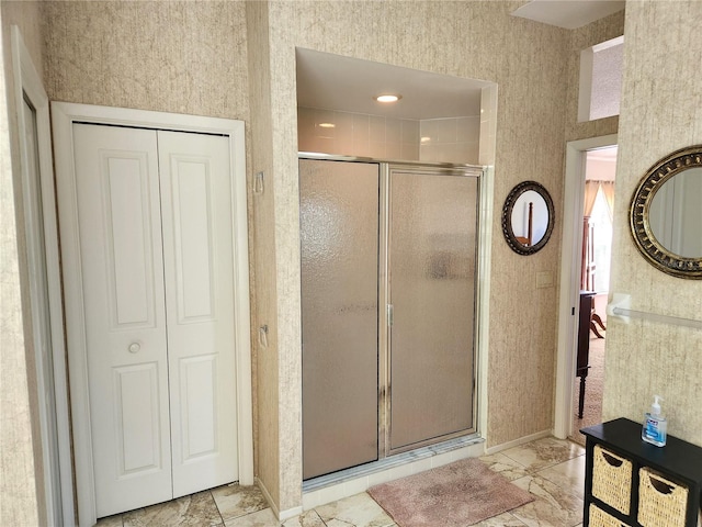 full bath with a closet and a stall shower