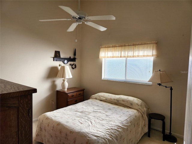 bedroom featuring ceiling fan and baseboards