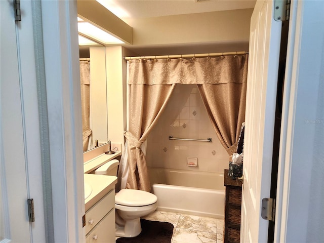 bathroom with toilet, shower / bath combo, and vanity