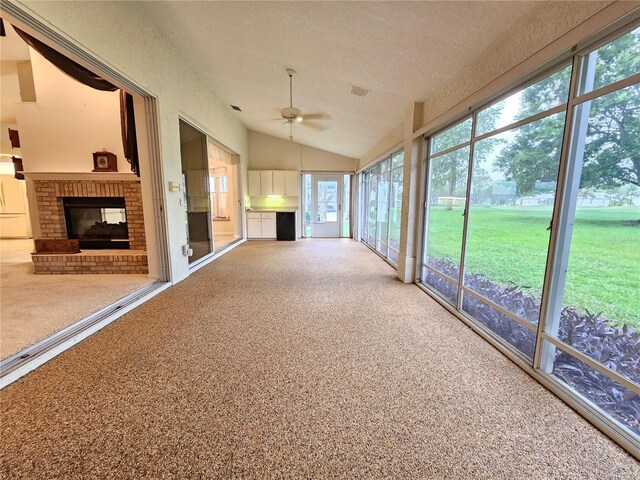 8157 Hidden Hills Dr, Spring Hill, FL 34606 - unfurnished sunroom featuring vaulted ceiling and plenty of natural light