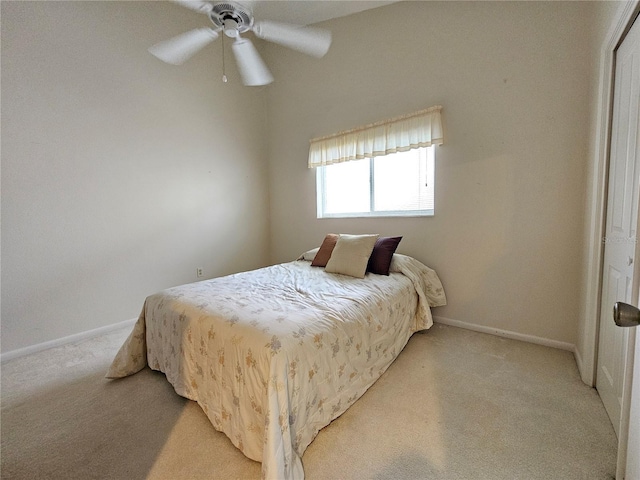 8157 Hidden Hills Dr, Spring Hill, FL 34606 - bedroom with light carpet, baseboards, and a ceiling fan
