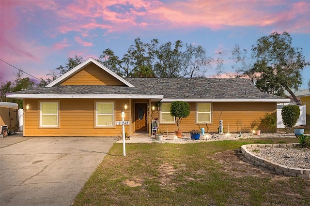 ranch-style house with a yard