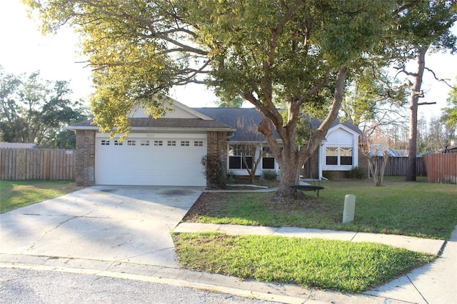 ranch-style house featuring a garage, fence, concrete driveway, and brick siding