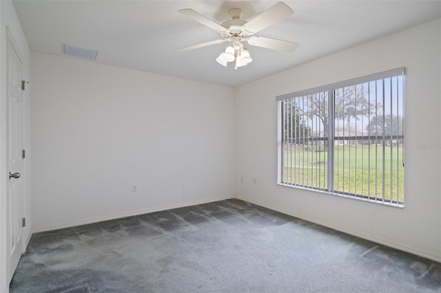 unfurnished room with baseboards, ceiling fan, visible vents, and carpet flooring