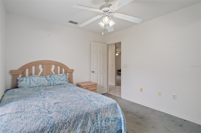 carpeted bedroom featuring baseboards, visible vents, and a ceiling fan