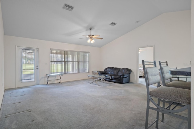 interior space with lofted ceiling, ceiling fan, and visible vents