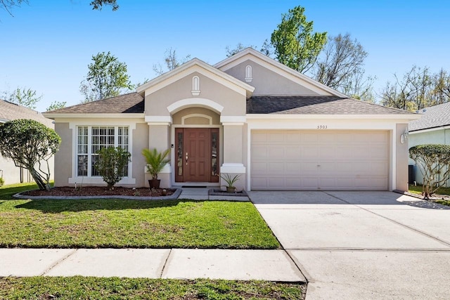 ranch-style house with roof with shingles, stucco siding, an attached garage, driveway, and a front lawn