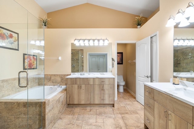 full bathroom with lofted ceiling, a garden tub, a sink, and toilet