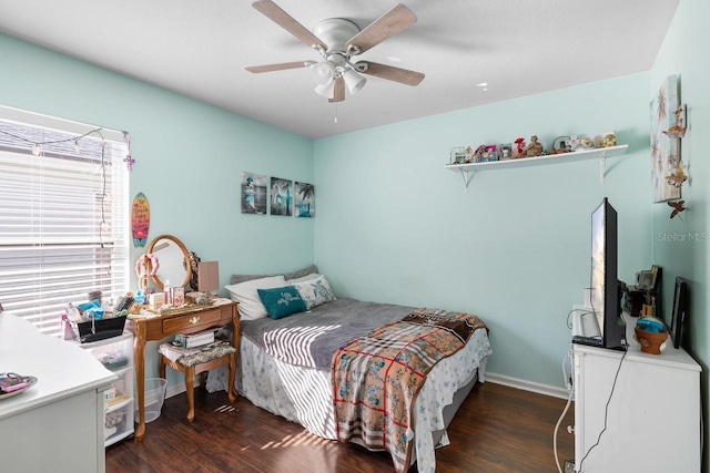 bedroom featuring dark wood-style flooring and a ceiling fan