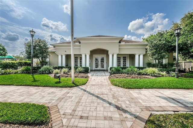 5903 War Admiral Dr, Wesley Chapel, FL 33544 - view of front of house featuring french doors and stucco siding