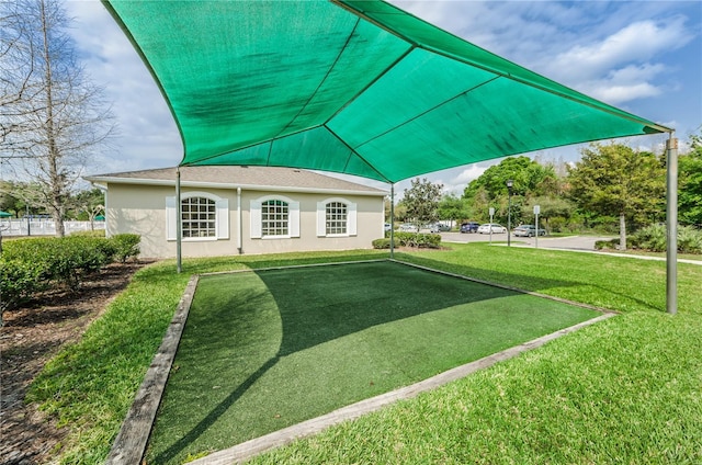 5903 War Admiral Dr, Wesley Chapel, FL 33544 - view of grassy yard featuring a putting area