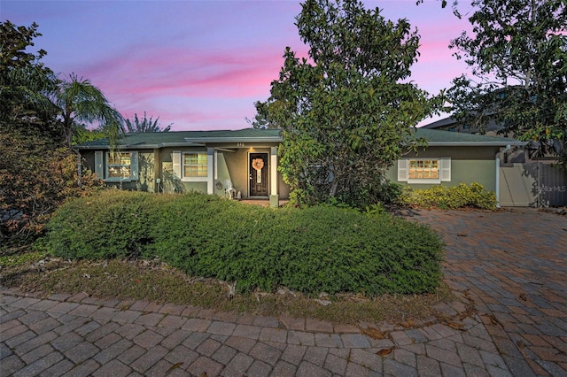 single story home featuring fence and stucco siding