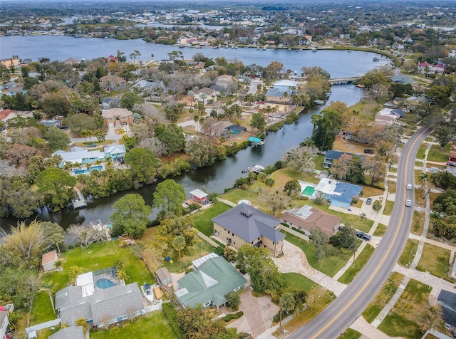 birds eye view of property featuring a water view and a residential view