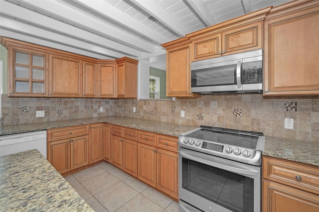 kitchen featuring tasteful backsplash, appliances with stainless steel finishes, beamed ceiling, and light tile patterned flooring