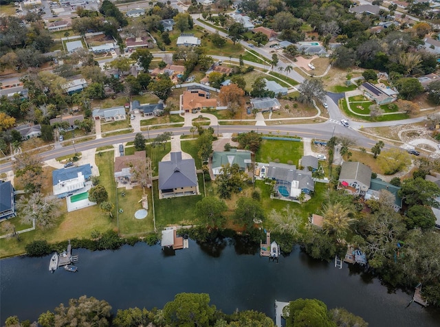 drone / aerial view featuring a water view and a residential view