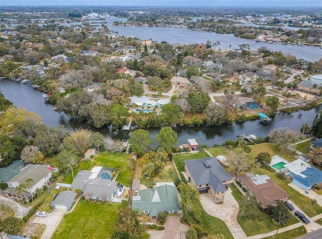 drone / aerial view with a water view and a residential view