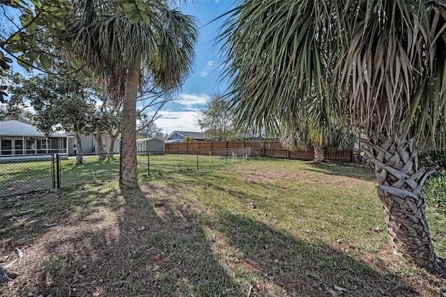 view of yard with a fenced backyard