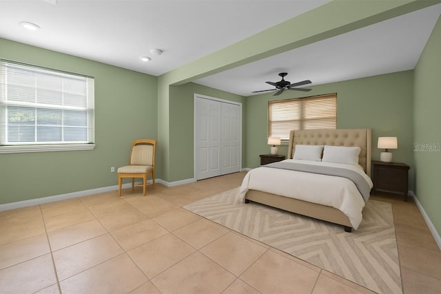 646 Riverside Dr, Tarpon Springs, FL 34689 - bedroom with a closet, tile patterned floors, and a ceiling fan