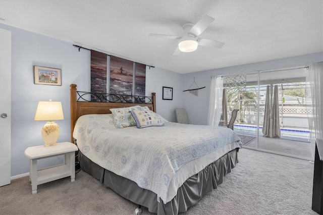 carpeted bedroom with access to exterior, baseboards, and a ceiling fan