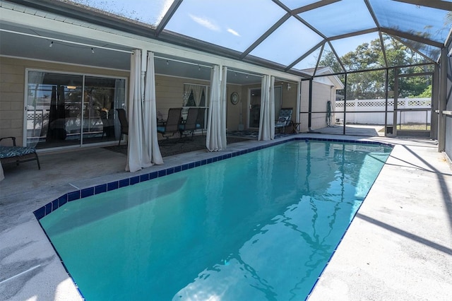 view of pool featuring a fenced in pool, a lanai, a patio, and fence