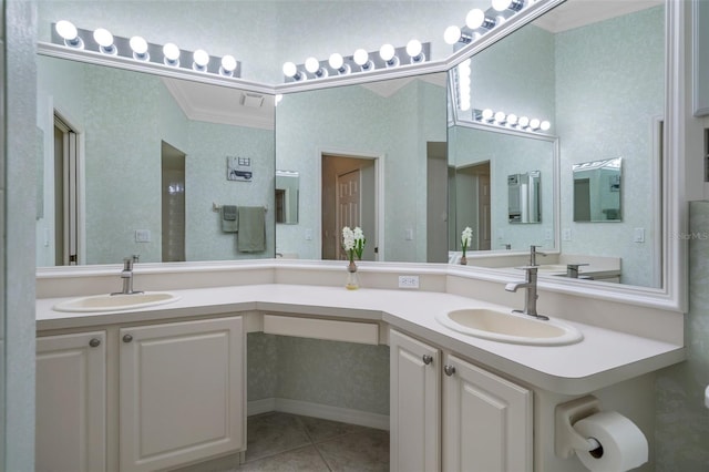 full bathroom with double vanity, ornamental molding, a sink, and tile patterned flooring
