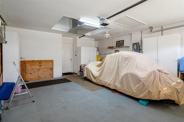 garage with electric panel, a garage door opener, and ceiling fan